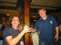 Andy Knights tells Allan Ellis to look after the trophy - it is only on loan