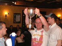 Fat Bald kid lifts the trophy