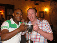 Jermaine Jones and Jamey Cox lift the cup