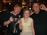 Allan Ellis, Jimmy Bradley and Lauren lifting the trophy